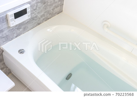 Bathtub in the bathroom with hot water 70223568