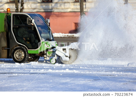 street cleaning the city from snow with the help of special machinery street cleaning the city from snow with the help of special machinery 70223674