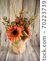 Red sunflowers isolated on the wood background 70223739