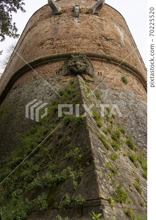 Medieval brick walls and ramparts-Historic center of Siena, Italy 70225520