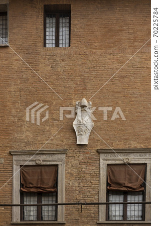 Brick walls and windows of the medieval European city-Historic center of Siena, Italy Brick walls and windows of the medieval European city-Historic center of Siena, Italy 70225784