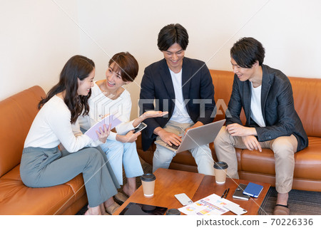A friendly meeting scene in a business office A friendly meeting scene in a business office 70226336