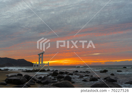 "Meotoiwa of Sakurai Futigaura" at sunset, Itoshima City, Fukuoka Prefecture 70227526