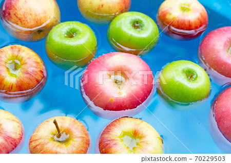 Washing fresh apples in the water 70229503