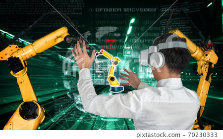Engineer controls robotic arms by augmented reality industry technology Engineer controls robotic arms by augmented reality industry technology 70230333