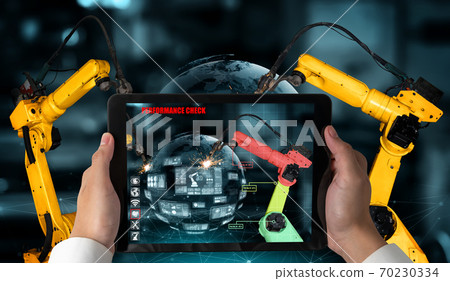Engineer controls robotic arms by augmented reality industry technology Engineer controls robotic arms by augmented reality industry technology 70230334