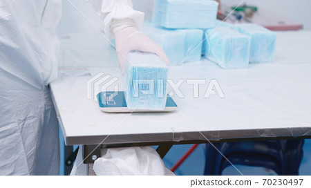 Face mask production line in modern factory 70230497