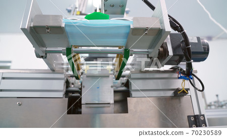 Face mask production line in modern factory 70230589