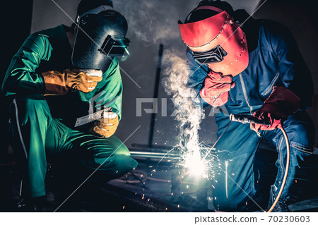 Metal welding steel works using electric arc welding machine 70230603