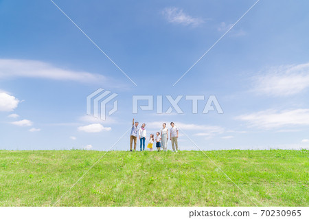 Three generations family, blue sky, walking 70230965