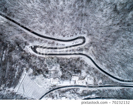 Seasons Concept winter snowy Aerial view Winding road serpentine mountain pass village Brodenbach Germany Seasons Concept winter snowy Aerial view Winding road serpentine mountain pass village Brodenbach Germany 70232132