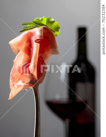 Prosciutto with rosemary. 70232384