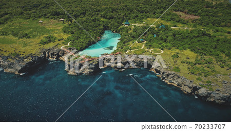Green rock shore at ocean bay with tropical salt water lake aerial view. Nobody tropical nature Green rock shore at ocean bay with tropical salt water lake aerial view. Nobody tropical nature 70233707
