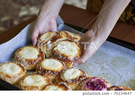 Freshly baked raspberry and cottage cheese buns Freshly baked raspberry and cottage cheese buns 70234647