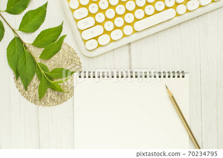 Yellow keyboard and writing instruments 70234795