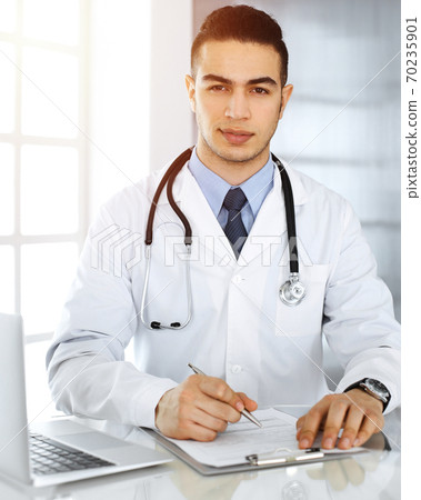 Arab Doctor Man Is Using Laptop Computer While Stock Photo 70235901 Pixta