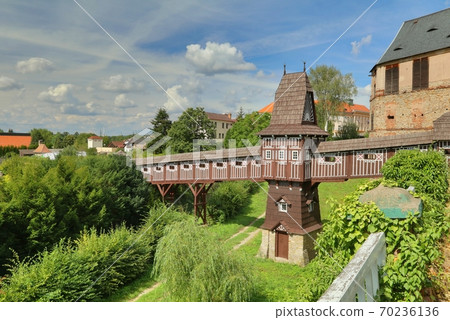 Covered wooden bridge in castle garden in Nove Meste nad Metuji city 70236136