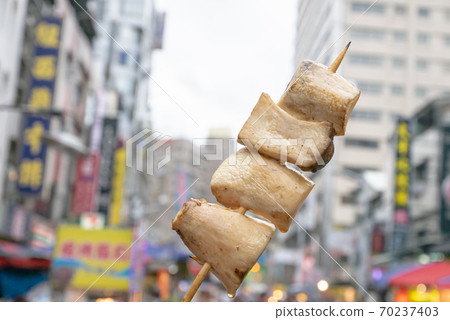 The close up of Taiwanese traditional barbecue (BBQ) food at night market background in Taiwan. The close up of Taiwanese traditional barbecue (BBQ) food at night market background in Taiwan. 70237403
