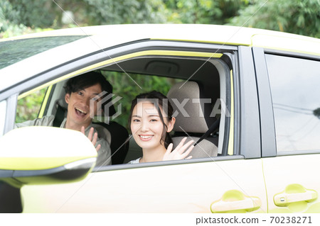 Men and women going out by car 70238271