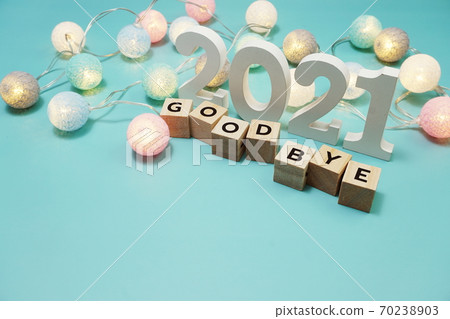 Goodbye 2021 alphabet letters with space copy on blue background Goodbye 2021 alphabet letters with space copy on blue background 70238903