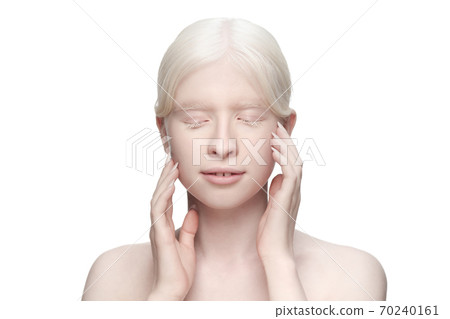 Portrait of beautiful albino woman isolated on white studio background. Beauty, fashion, skincare, cosmetics concept. Portrait of beautiful albino woman isolated on white studio background. Beauty, fashion, skincare, cosmetics concept. 70240161