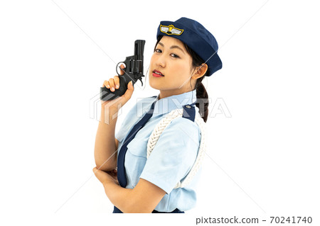 Policewoman holding a pistol Policewoman holding a pistol 70241740