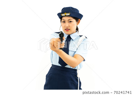 Policewoman holding a pistol Policewoman holding a pistol 70241741