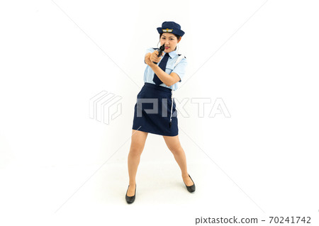 Policewoman holding a pistol Policewoman holding a pistol 70241742