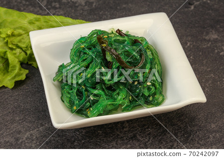 Green Chuka Seaweed Salad Isolated on White Background Top View. Wakame Sea Kelp Salat 70242097
