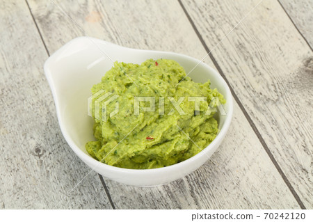 Avocado guacamole sauce with chili pepper 70242120