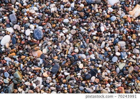 Background of colored sea pebbles on the beach of Alanya, Turkey. Seamless texture Background of colored sea pebbles on the beach of Alanya, Turkey. Seamless texture 70243991
