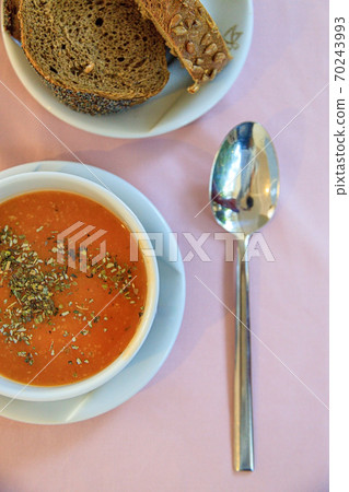 Turkish red lentil cream soup with spices, rye bread on the table in the restaurant. View from above Turkish red lentil cream soup with spices, rye bread on the table in the restaurant. View from above 70243993