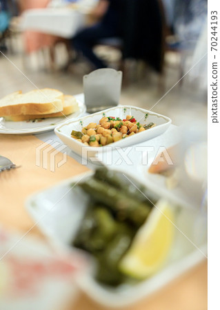 Traditional Turkish appetizers, chickpeas, dolma served in the restaurant Traditional Turkish appetizers, chickpeas, dolma served in the restaurant 70244193