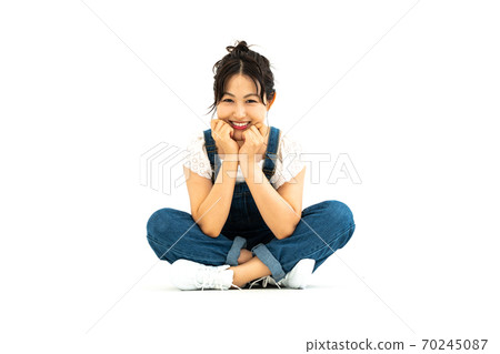 Young woman in overalls Young woman in overalls 70245087
