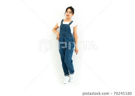 Young woman in overalls Young woman in overalls 70245180