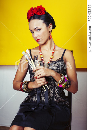 young pretty mexican woman smiling happy on yellow background, lifestyle people concept young pretty mexican woman smiling happy on yellow background, lifestyle people concept 70245233