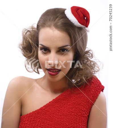 young pretty happy smiling brunette woman on christmas in santas red hat isolated heart gift, lifestyle people concept young pretty happy smiling brunette woman on christmas in santas red hat isolated heart gift, lifestyle people concept 70245239