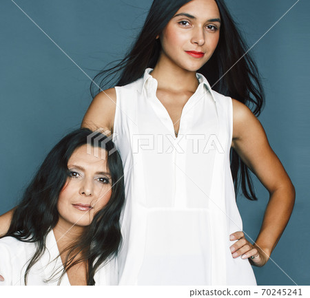 cute pretty teen daughter with mature mother hugging, fashion style brunette, lifestyle people concept cute pretty teen daughter with mature mother hugging, fashion style brunette, lifestyle people concept 70245241