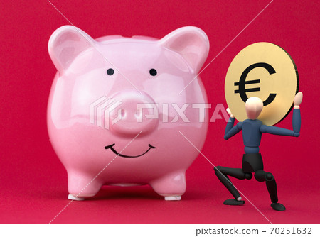 A caractere holding a euro golden coin in his Stock Photo