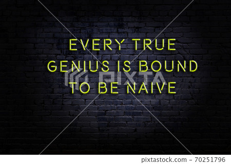 Wise quote. Neon inscription against brick wall Wise quote. Neon inscription against brick wall 70251796