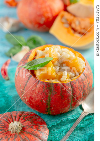 Pumpkin pearl barley risotto with parmesan. Pumpkin pearl barley risotto with parmesan. 70251975