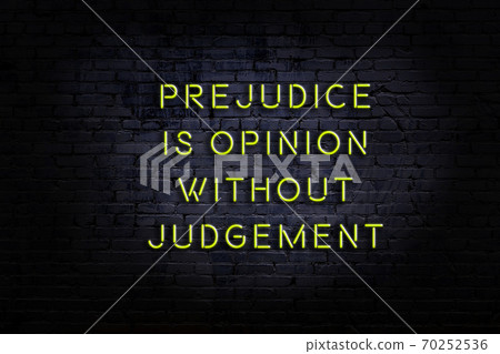 Wise quote. Neon inscription against brick wall 70252536