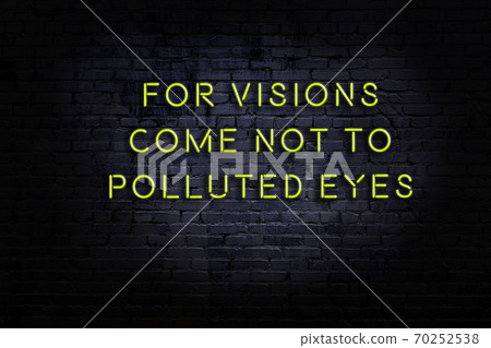 Wise quote. Neon inscription against brick wall Wise quote. Neon inscription against brick wall 70252538