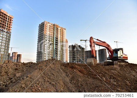 Excavator on earthmoving at construction site.  70253461