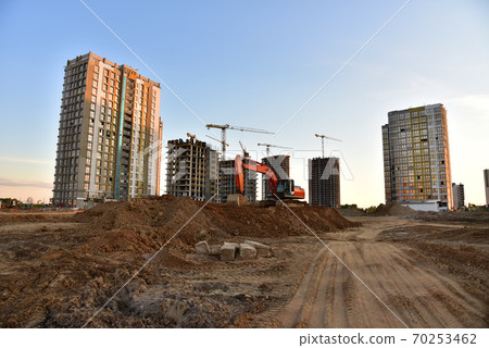 Excavator on earthmoving at construction site.  70253462