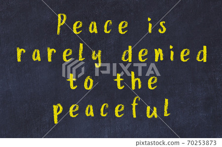 Black chalkboard with wise inscription on it Black chalkboard with wise inscription on it 70253873
