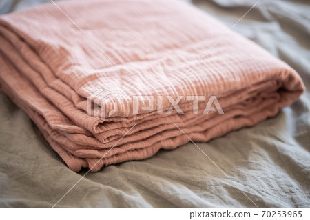 Pink blanket on the bed close up Pink blanket on the bed close up 70253965
