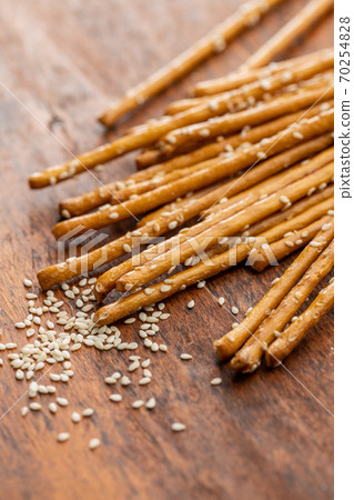 Salty sticks. Crunchy pretzels with sesame seeds 70254828