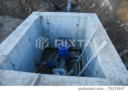 Resilient Seated Gate Valves connect pipeline of water supply in concrete bunker at constructin site Resilient Seated Gate Valves connect pipeline of water supply in concrete bunker at constructin site 70255647