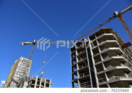Preparing to pour a bucket of concrete into formwork. Preparing to pour a bucket of concrete into formwork. 70255669